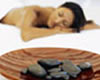 bowl of stones and womans massage